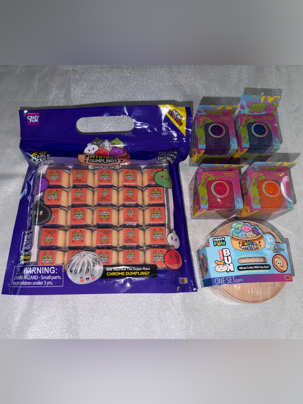 25 Mini Mystery Dumplings Chrome Edition, 2 Gummy Gum Drops & 1 Mystery Dumpling